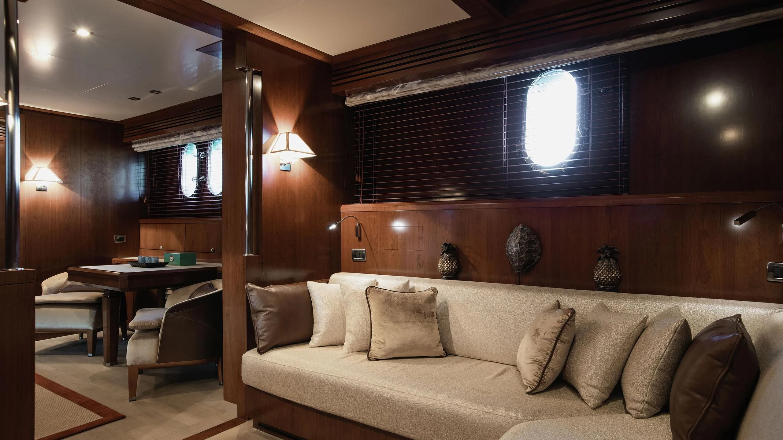 a living room with a couch and a table aboard W EXPLORER Yacht for Sale