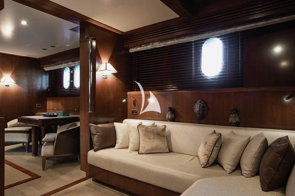 a living room with a couch and a table aboard W EXPLORER Yacht for Sale