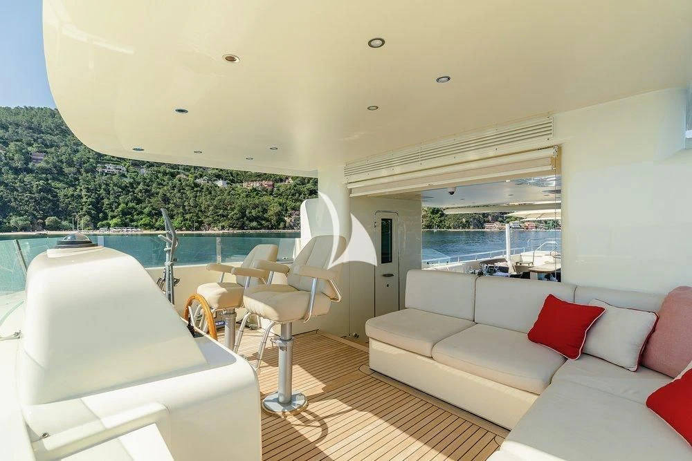 a room with a balcony and a view of the water aboard W EXPLORER Yacht for Sale
