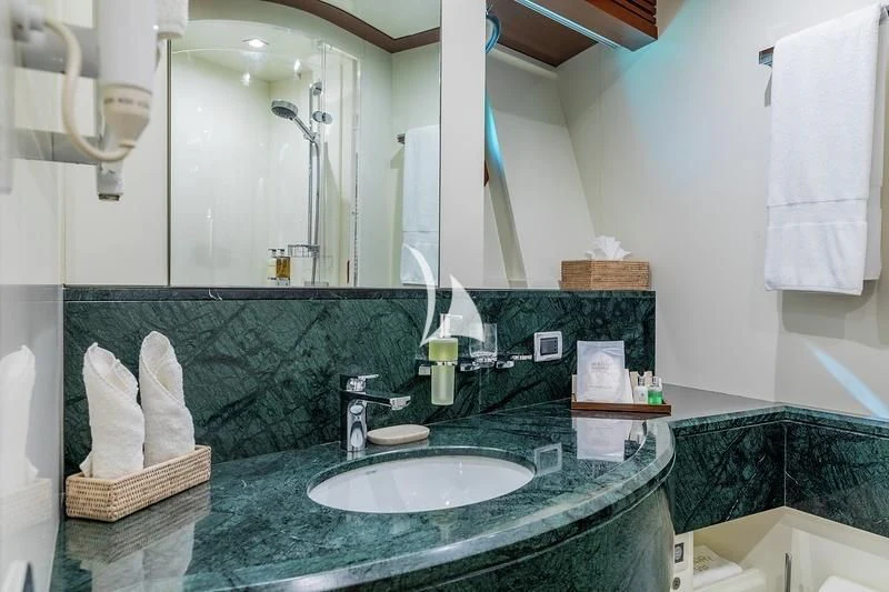 a bathroom with a large mirror aboard W EXPLORER Yacht for Sale