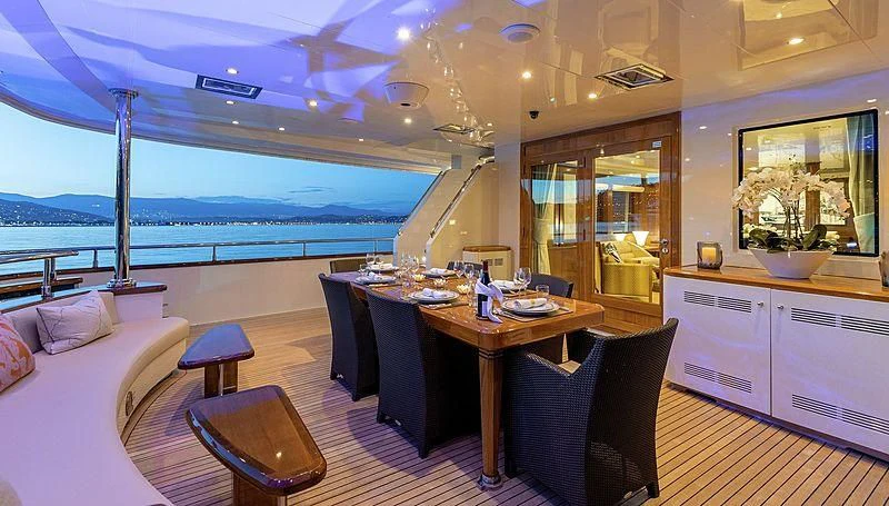 a room with a table and chairs aboard W EXPLORER Yacht for Sale