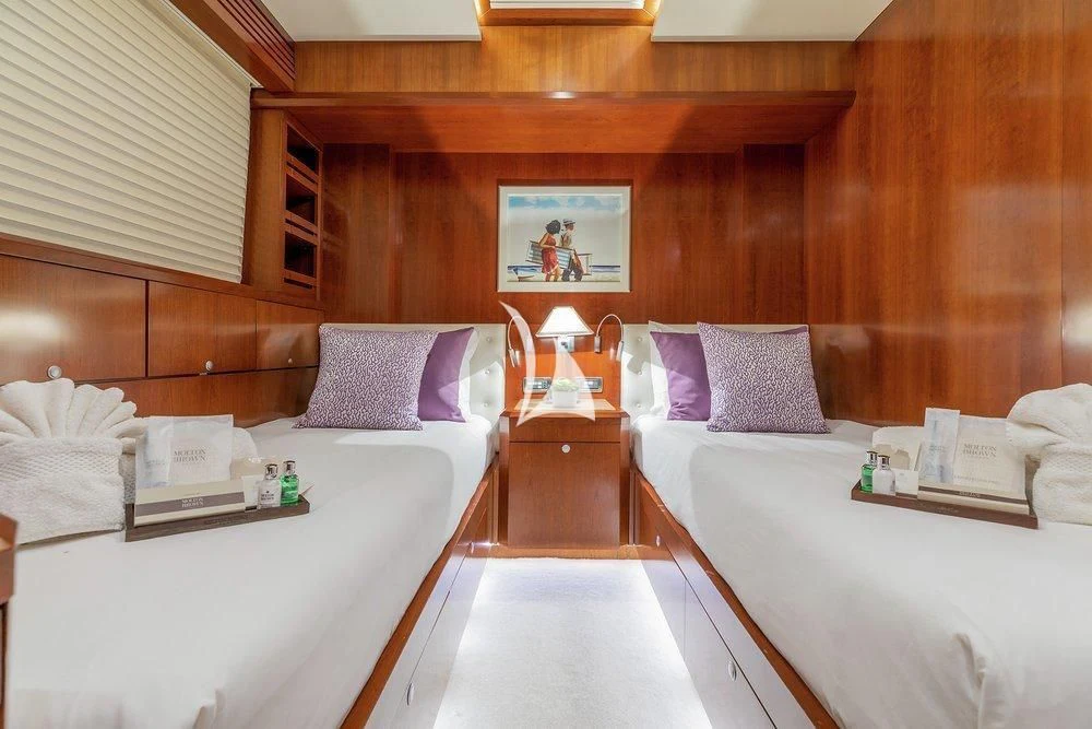 a room with two beds aboard W EXPLORER Yacht for Sale