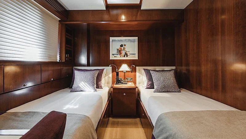 a couple of beds in a room aboard W EXPLORER Yacht for Sale