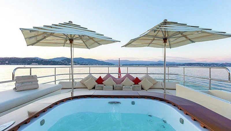 a boat with umbrellas on it aboard W EXPLORER Yacht for Sale