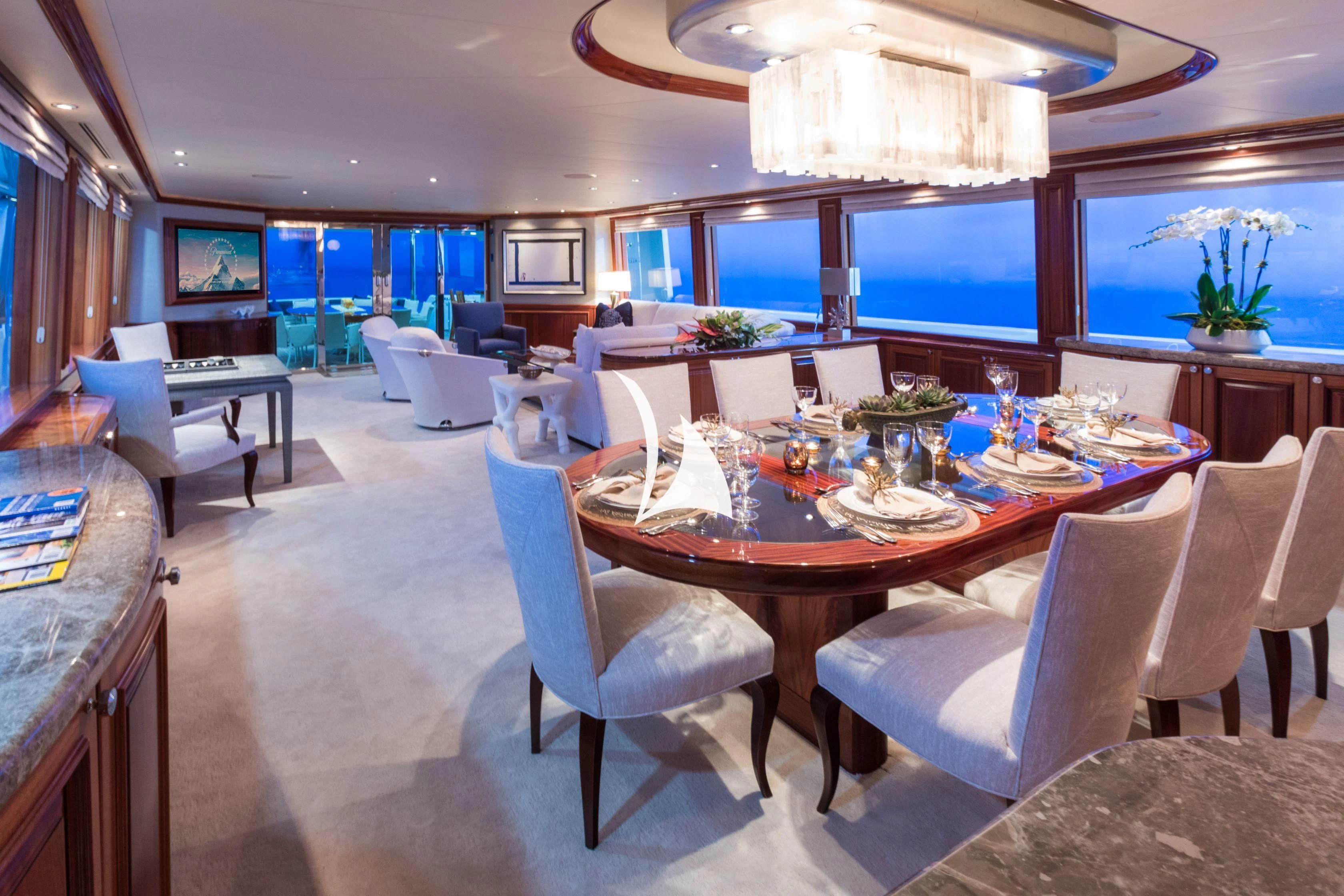 a dining room with a table and chairs aboard TRUST FUN Yacht for Sale
