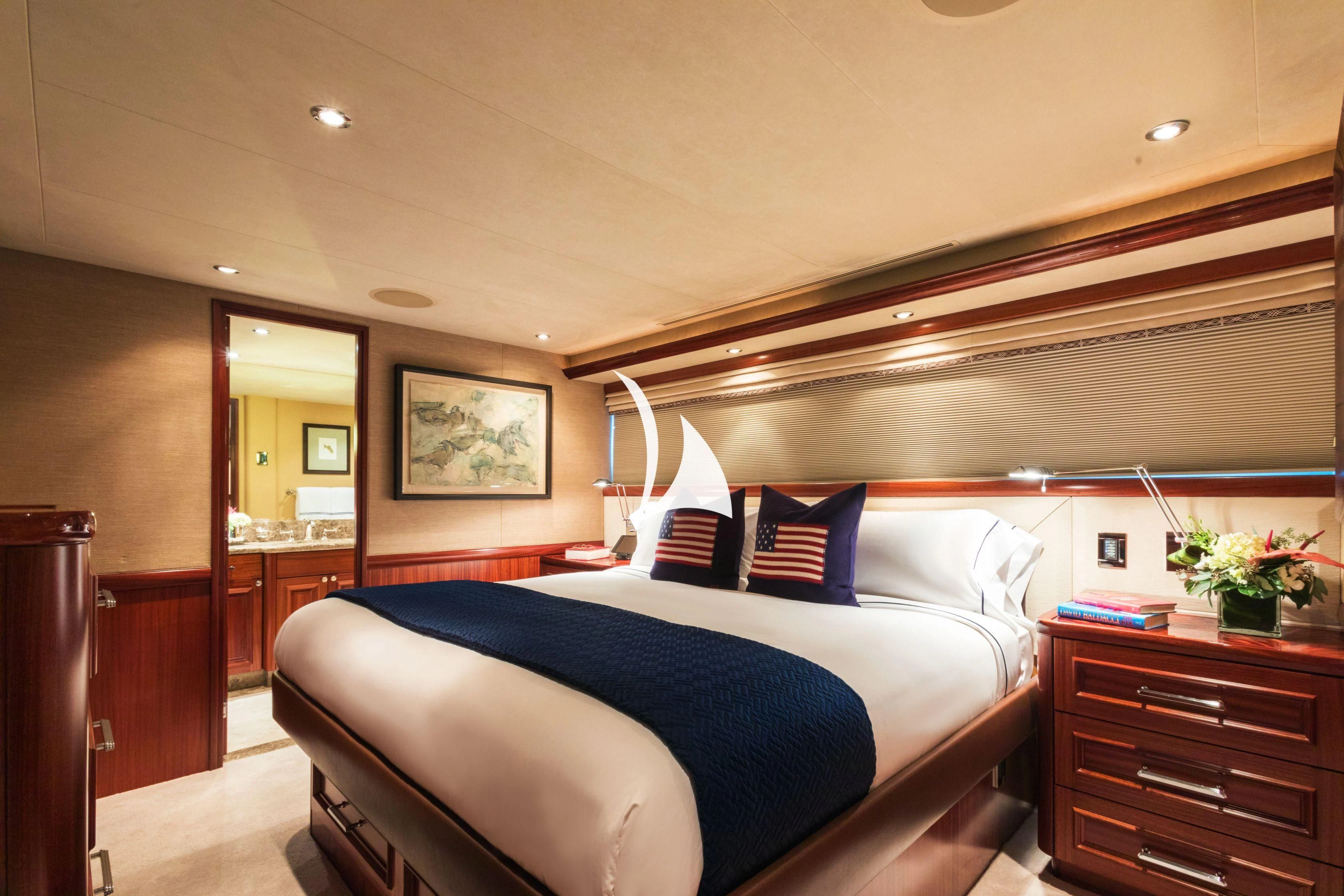 a bed with blue sheets aboard TRUST FUN Yacht for Sale