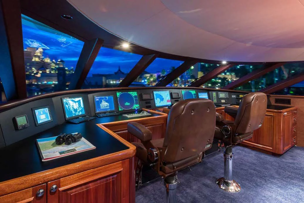 a room with a desk and chairs aboard TRUST FUN Yacht for Sale