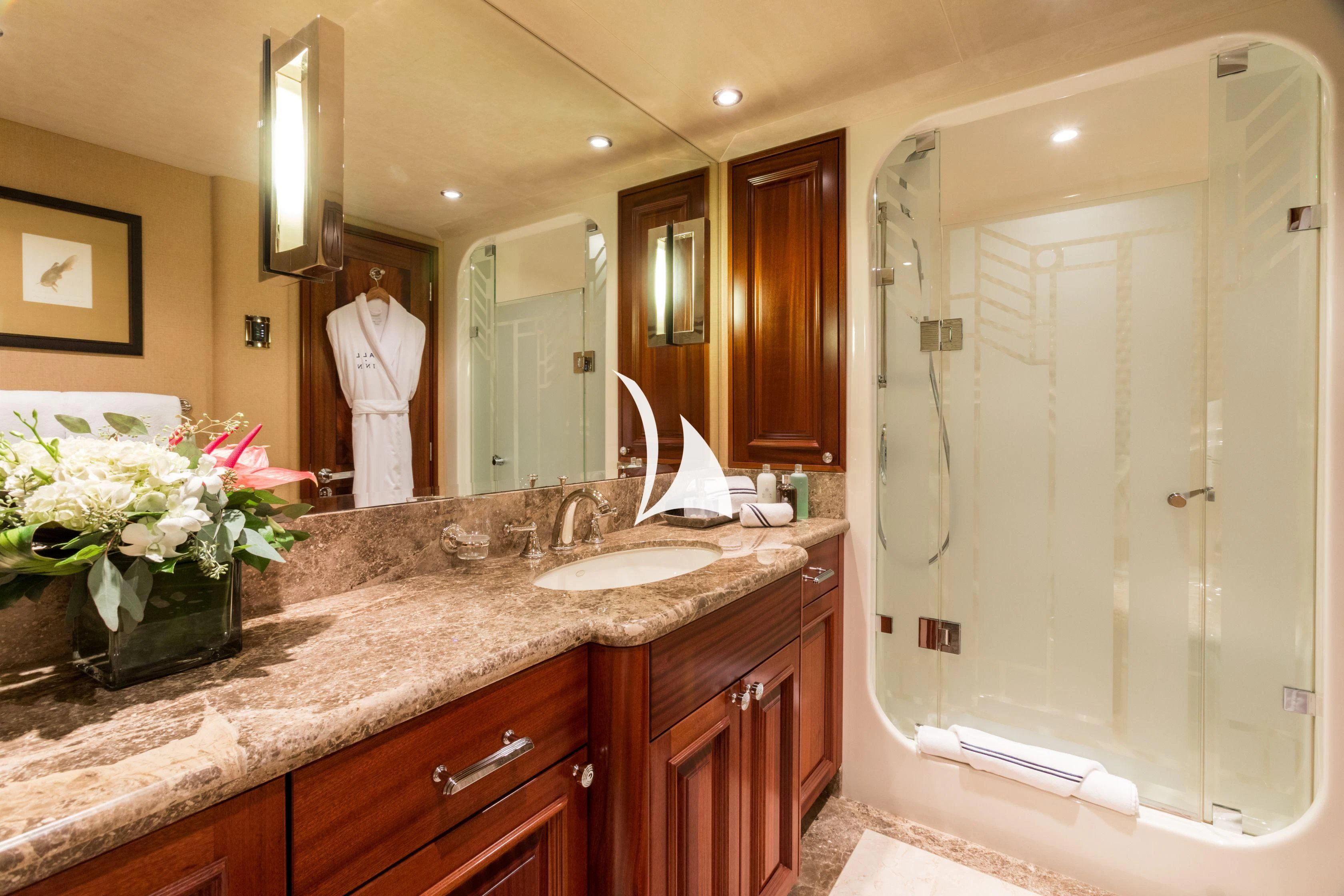 a bathroom with a large mirror aboard TRUST FUN Yacht for Sale