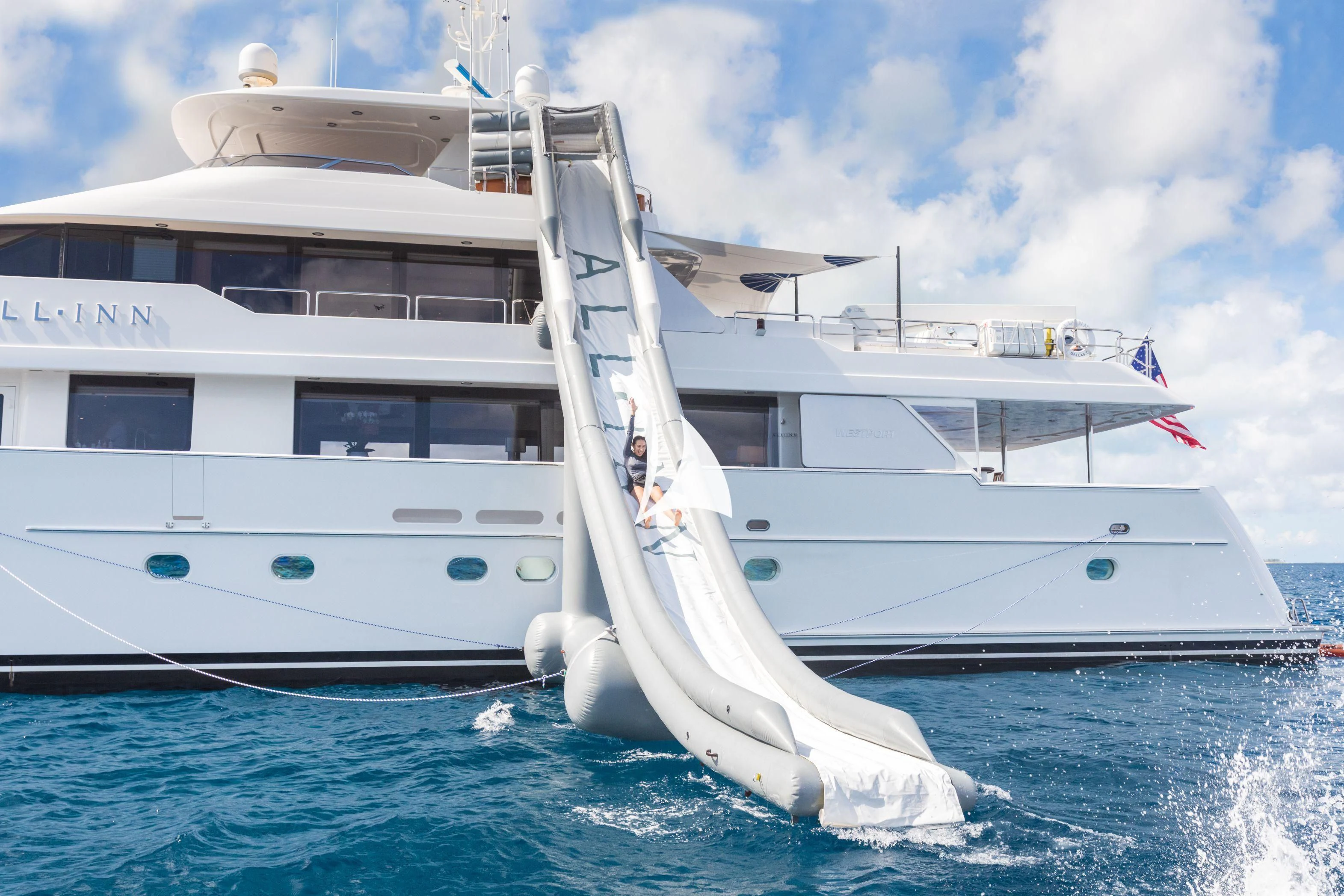 a white boat on the water aboard TRUST FUN Yacht for Sale