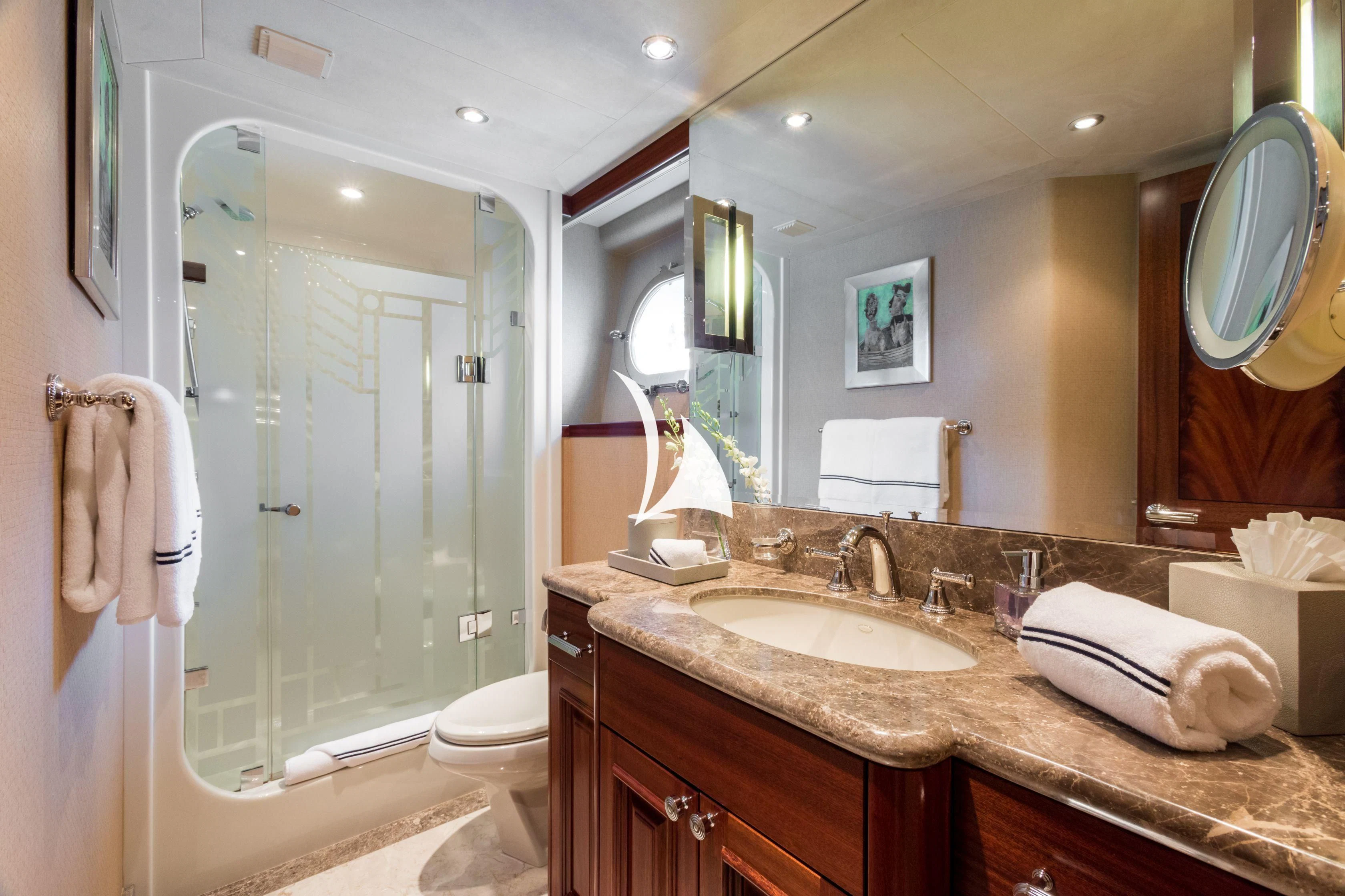 a bathroom with a large mirror aboard TRUST FUN Yacht for Sale