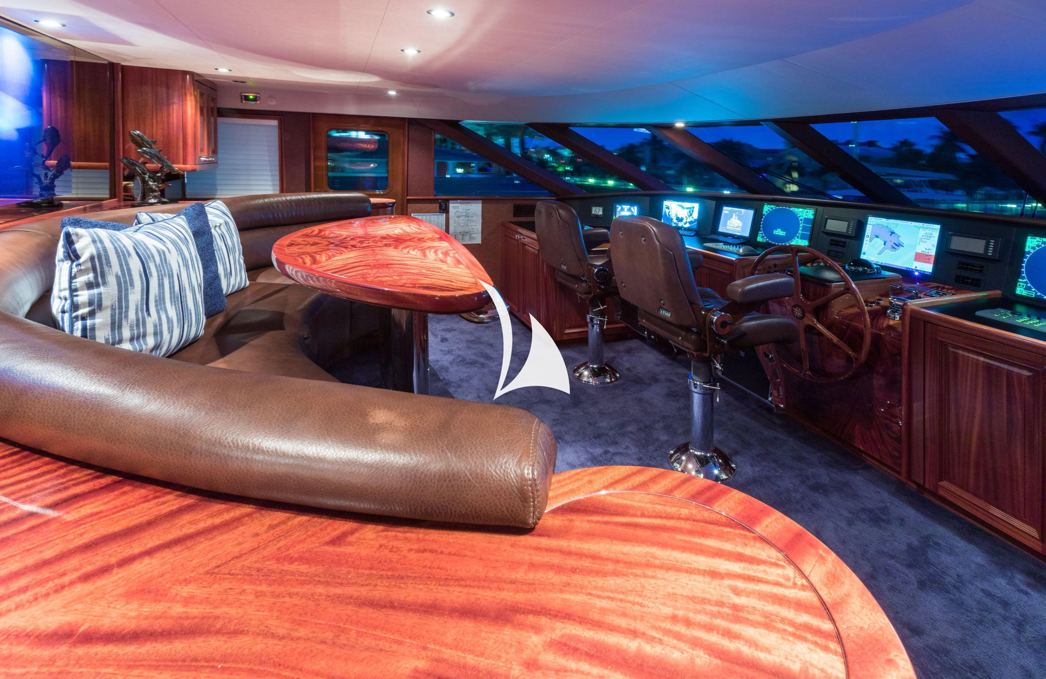 a room with a couch and a table with chairs aboard TRUST FUN Yacht for Sale