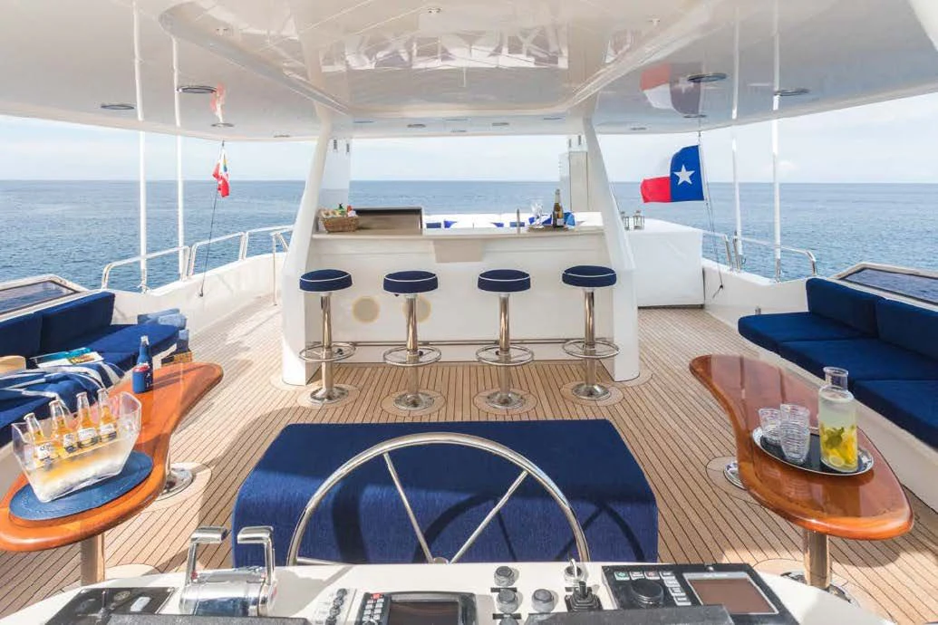 a large ship with stools and tables aboard TRUST FUN Yacht for Sale