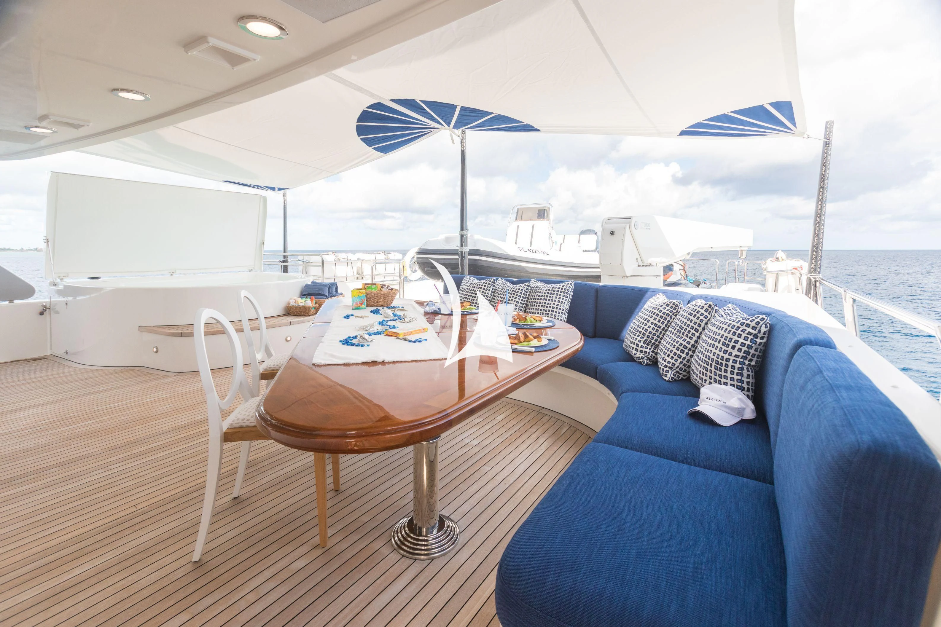 a table and chairs on a boat aboard TRUST FUN Yacht for Sale