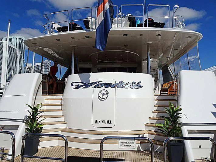 a boat with a sign on it aboard TRUST FUN Yacht for Sale