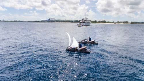 a couple people in a small boat aboard TRUST FUN Yacht for Sale