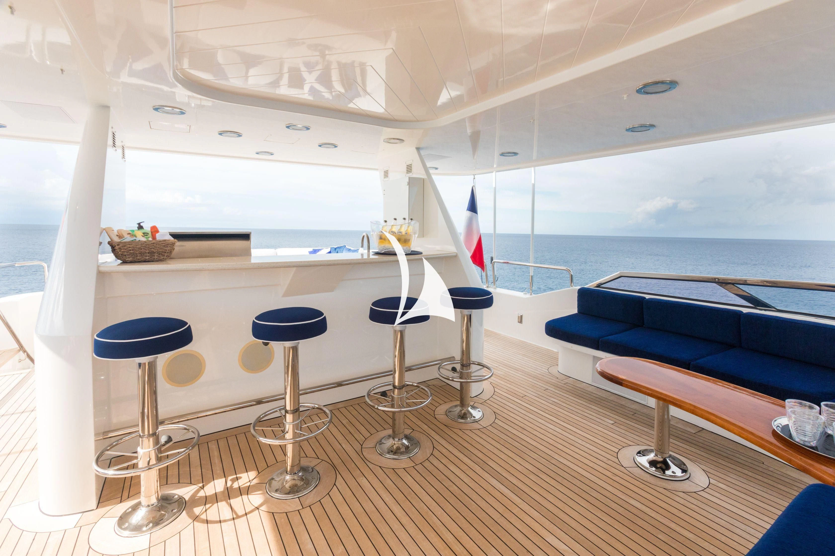 a room with a couch and a table and chairs aboard TRUST FUN Yacht for Sale