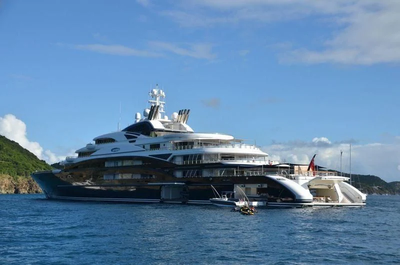 a large cruise ship docked aboard SERENE Yacht for Sale