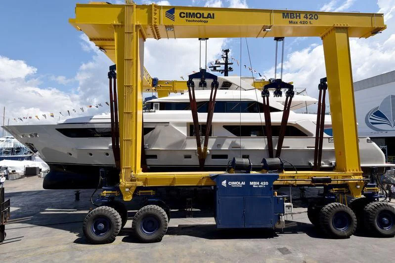 a large yellow crane on a trailer aboard SIM SIM I Yacht for Sale