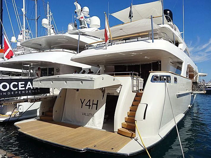 a boat docked at a pier aboard Y4H Yacht for Sale