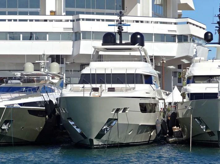 a couple of boats are parked in the water aboard Y4H Yacht for Sale