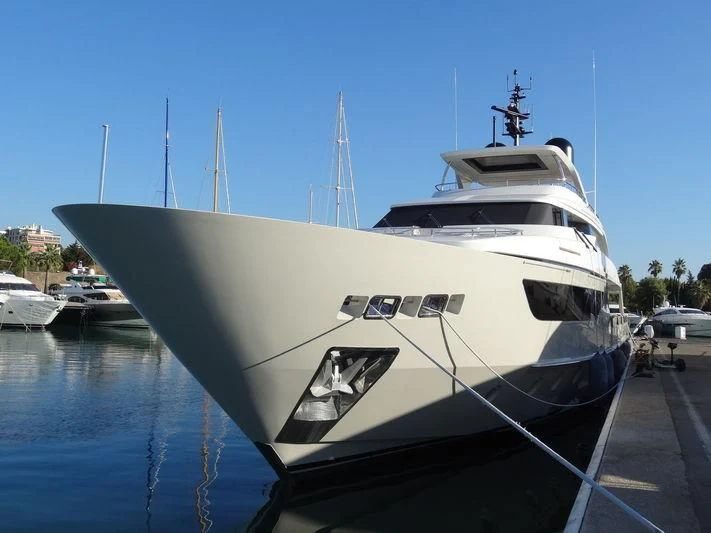 a large white yacht docked aboard Y4H Yacht for Sale