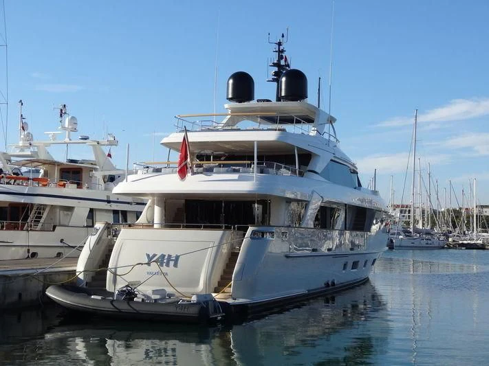 a couple of boats in a harbor aboard Y4H Yacht for Sale