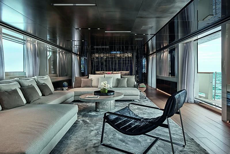 a living room with a couch and a coffee table aboard Y4H Yacht for Sale