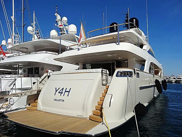 a boat docked at a pier aboard Y4H Yacht for Sale