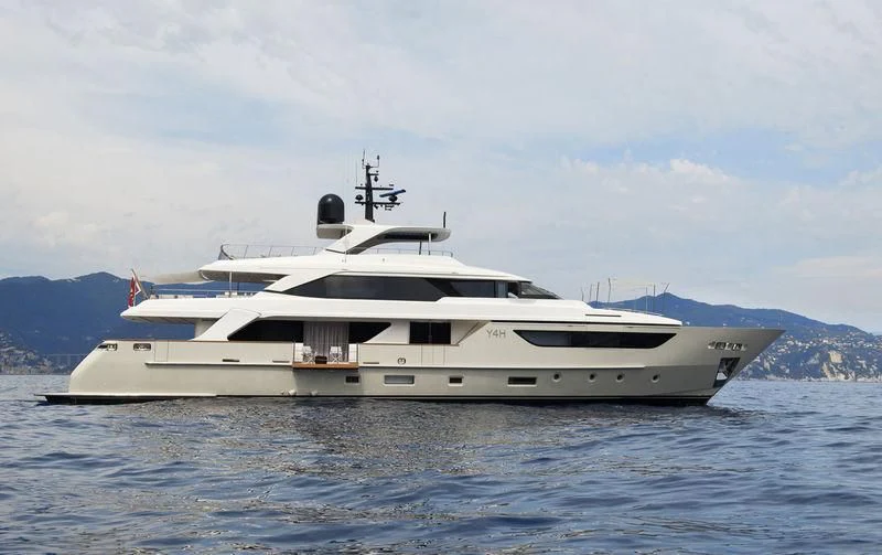 a large white yacht in the water aboard Y4H Yacht for Sale