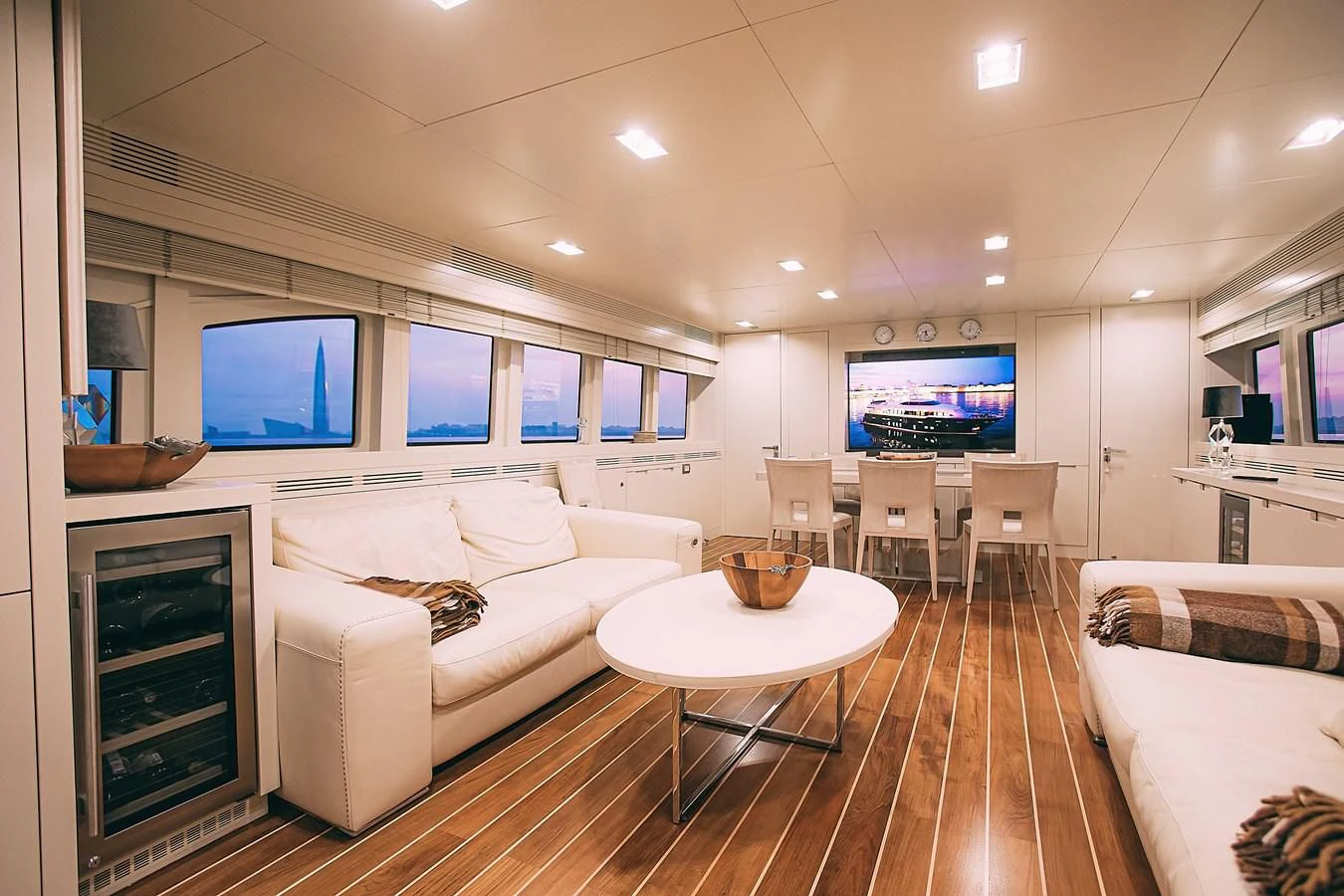 a living room with a large screen aboard KALISA Yacht for Sale