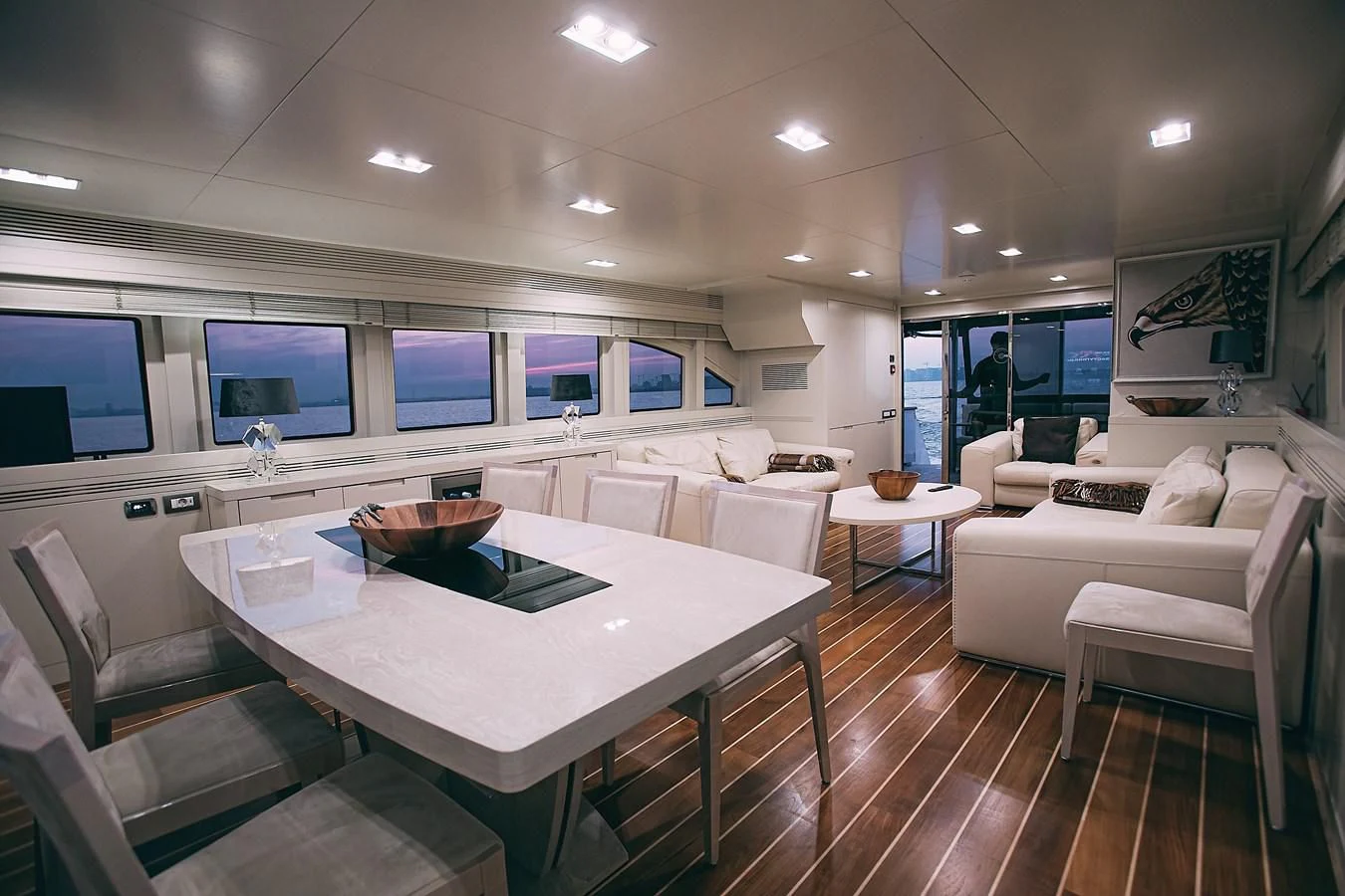 a large kitchen with a table and chairs aboard KALISA Yacht for Sale