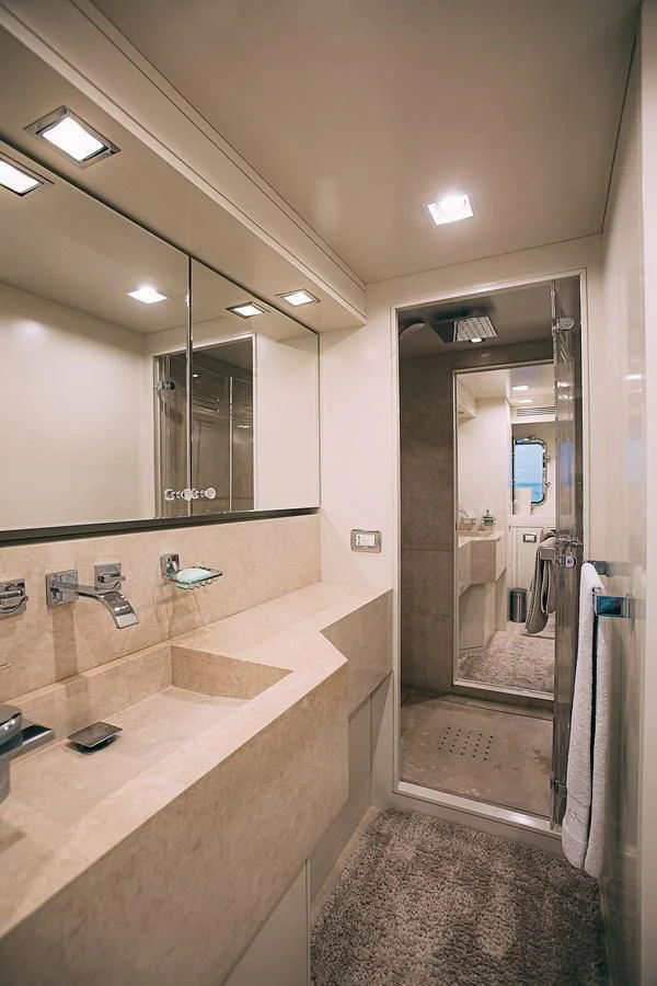 a bathroom with a marble countertop aboard KALISA Yacht for Sale