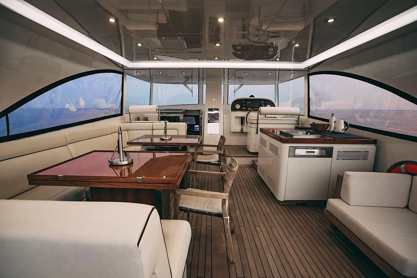 inside of a room with a table and chairs aboard KALISA Yacht for Sale