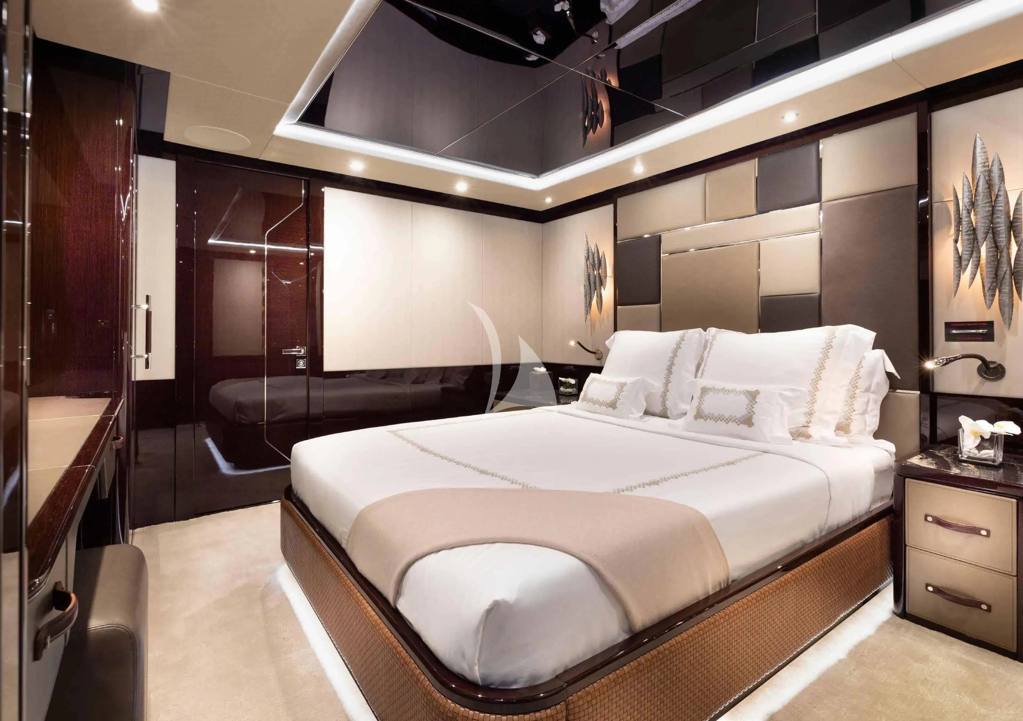 a large bed in a room aboard NEXUS Yacht for Charter