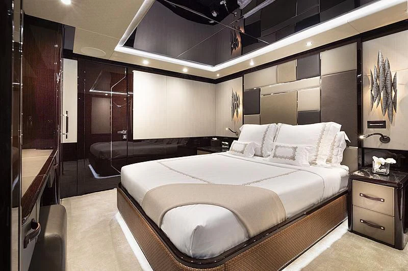 a large bedroom with a large bed aboard NEXUS Yacht for Charter