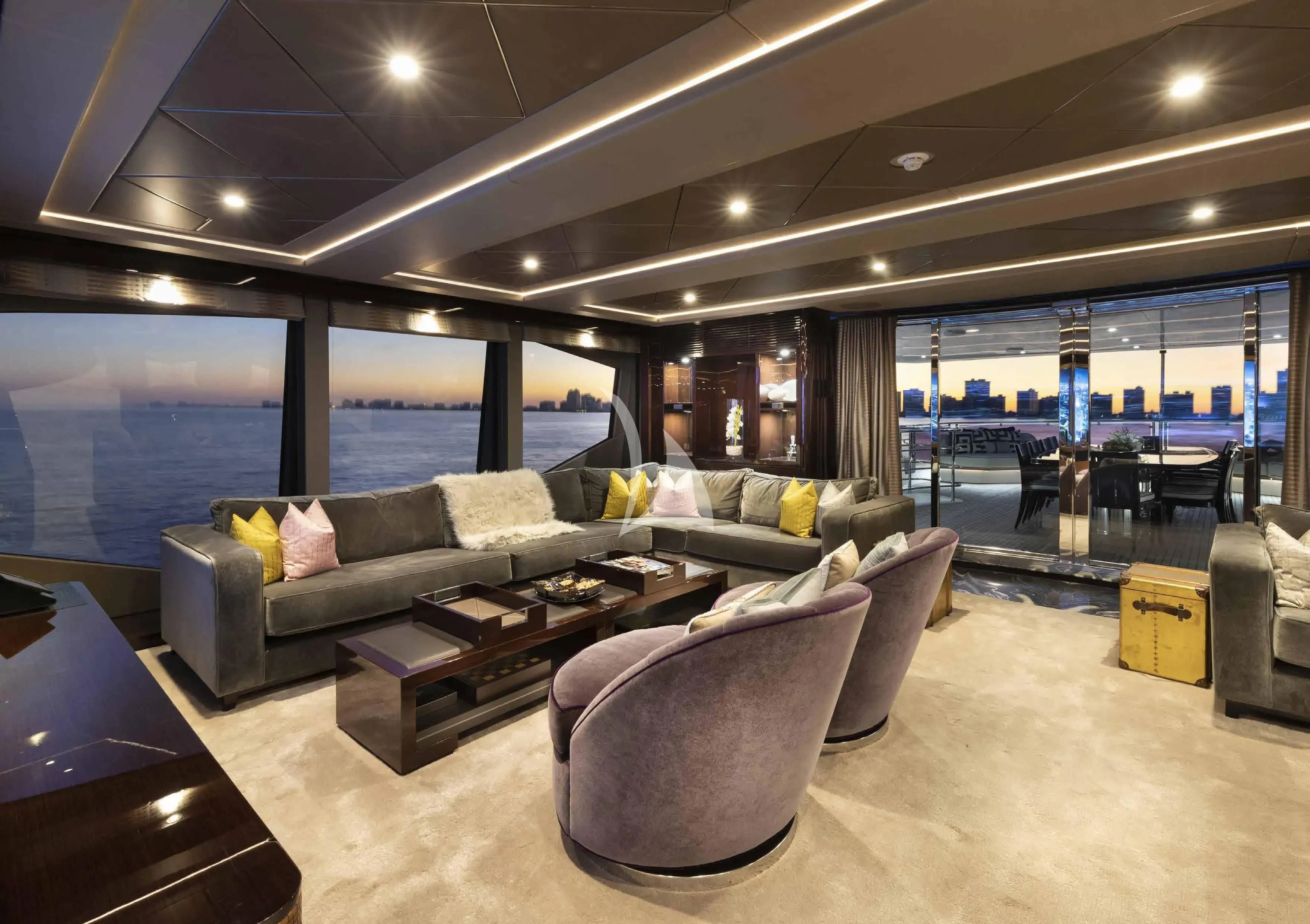 a living room with a large window aboard NEXUS Yacht for Charter