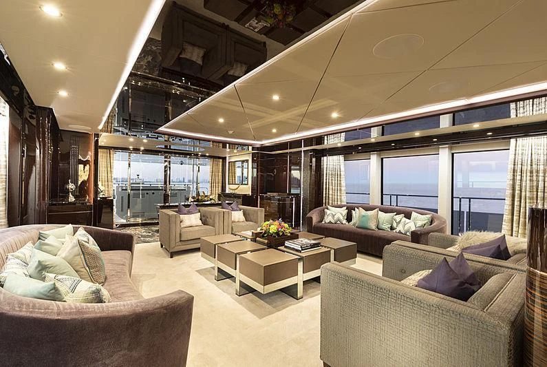 a living room with a large window aboard NEXUS Yacht for Charter