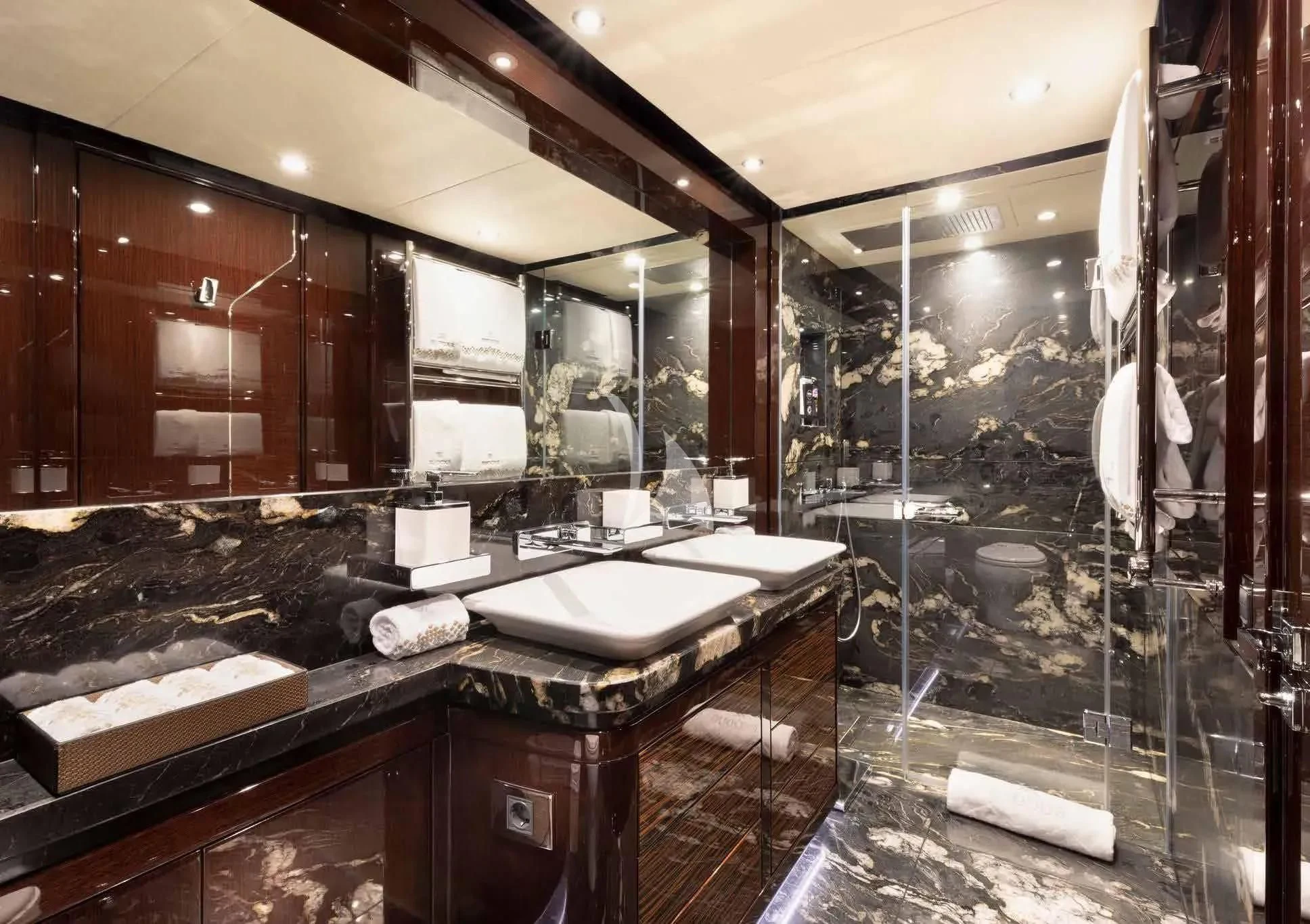 a bathroom with a large mirror aboard NEXUS Yacht for Charter