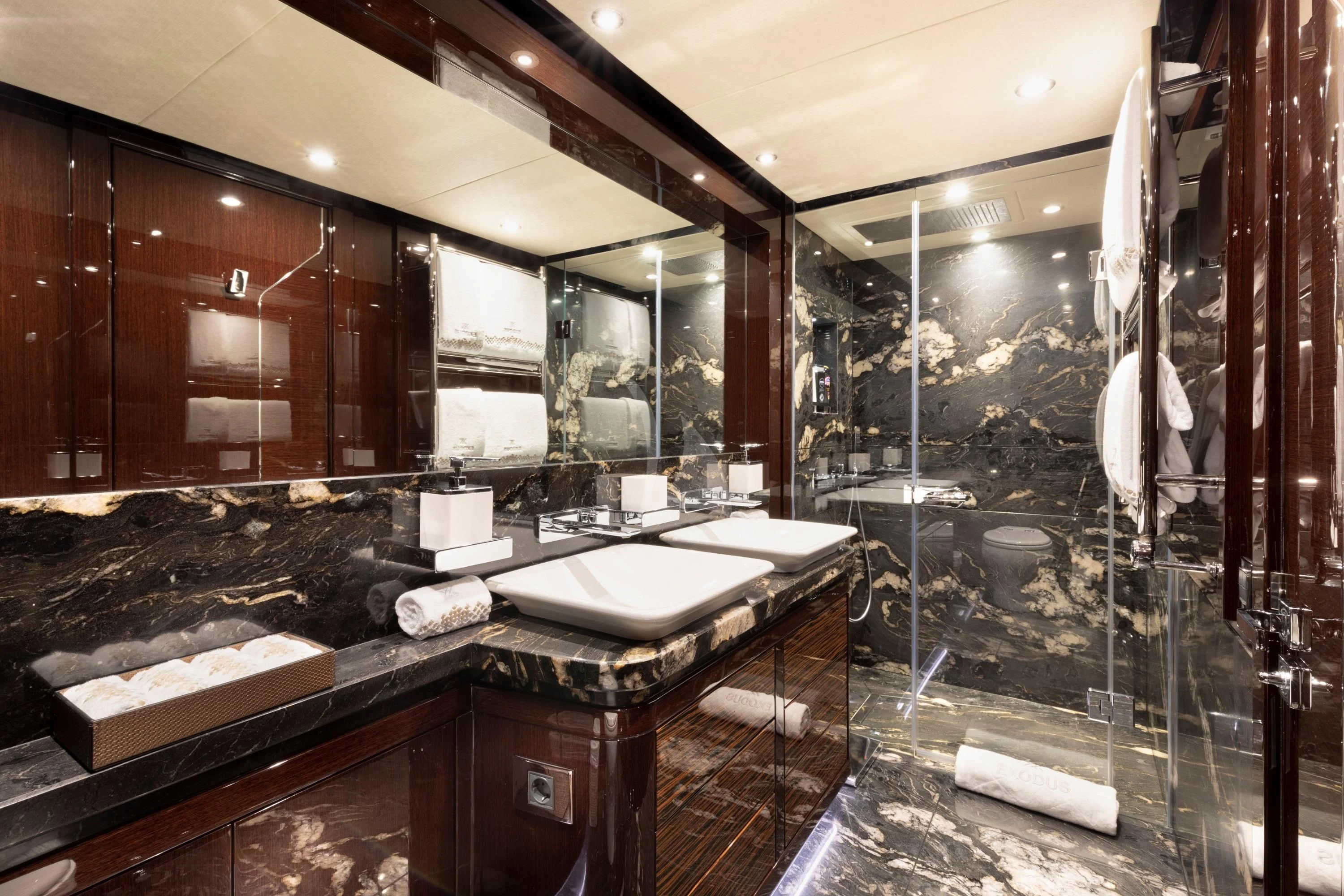 a bathroom with a large mirror aboard NEXUS Yacht for Charter