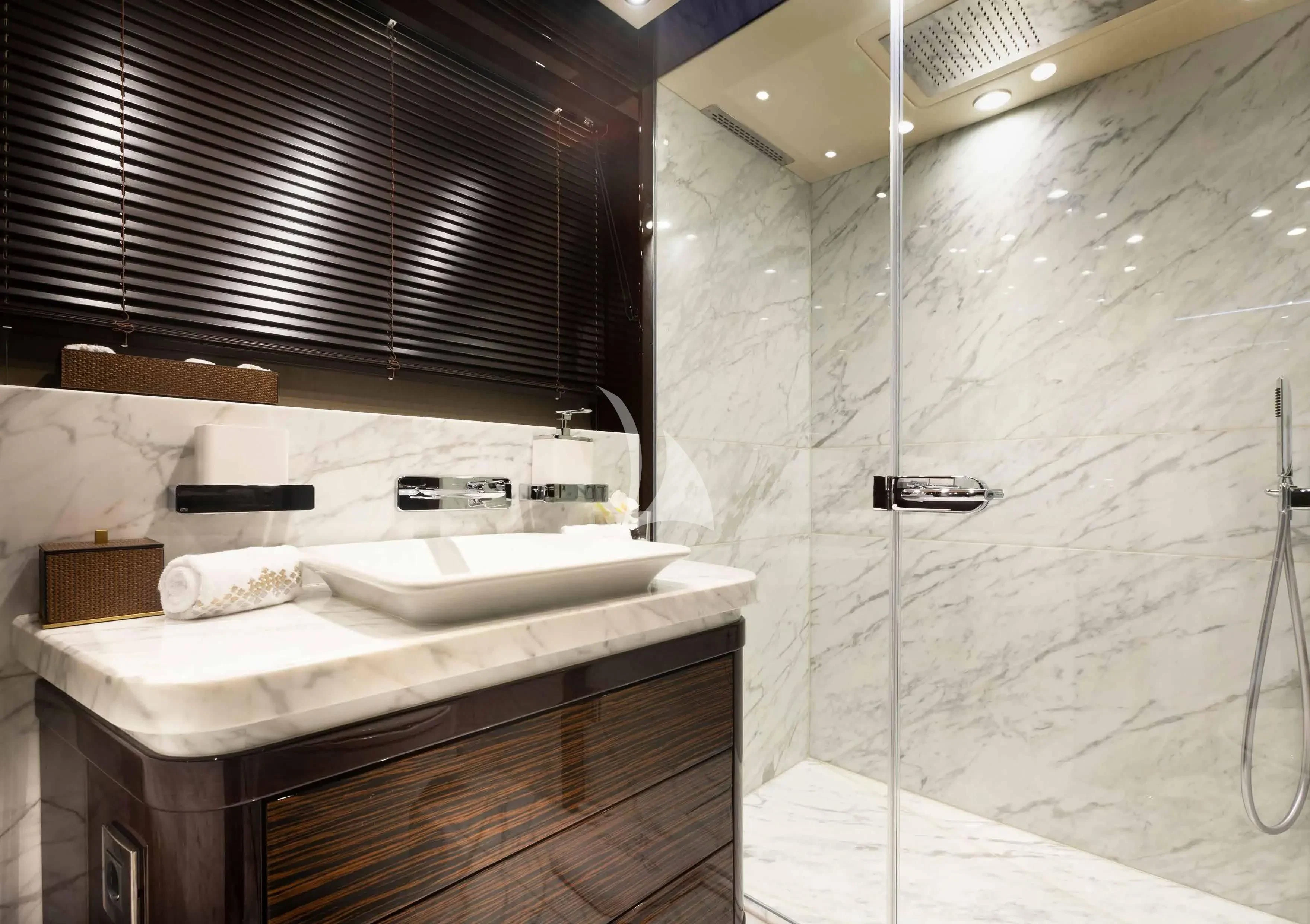 a bathroom with a sink and a shower aboard NEXUS Yacht for Charter