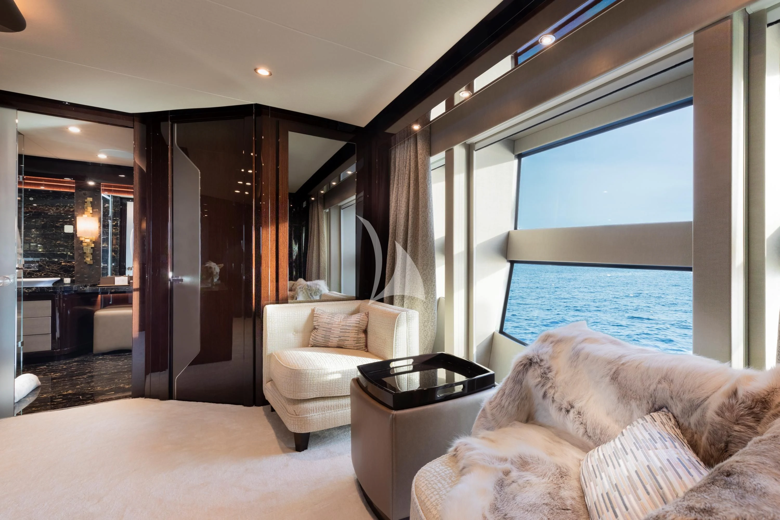 a living room with a large window aboard NEXUS Yacht for Charter