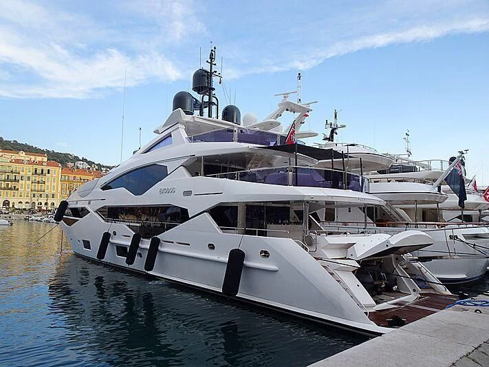 a white yacht docked aboard NEXUS Yacht for Charter