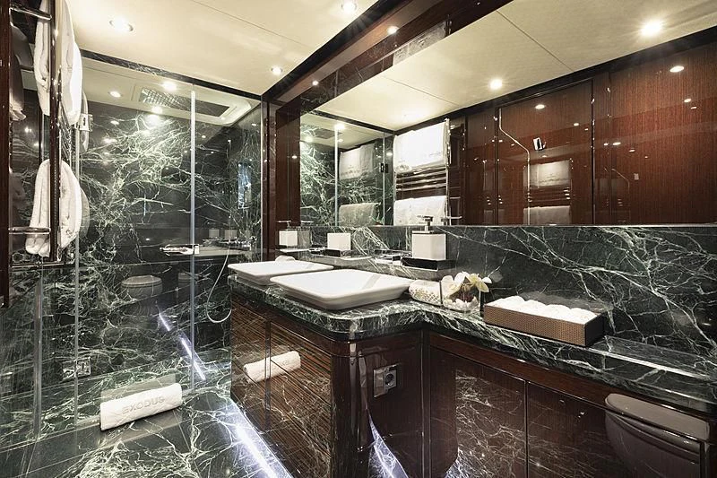 a bathroom with a large glass shower aboard NEXUS Yacht for Charter