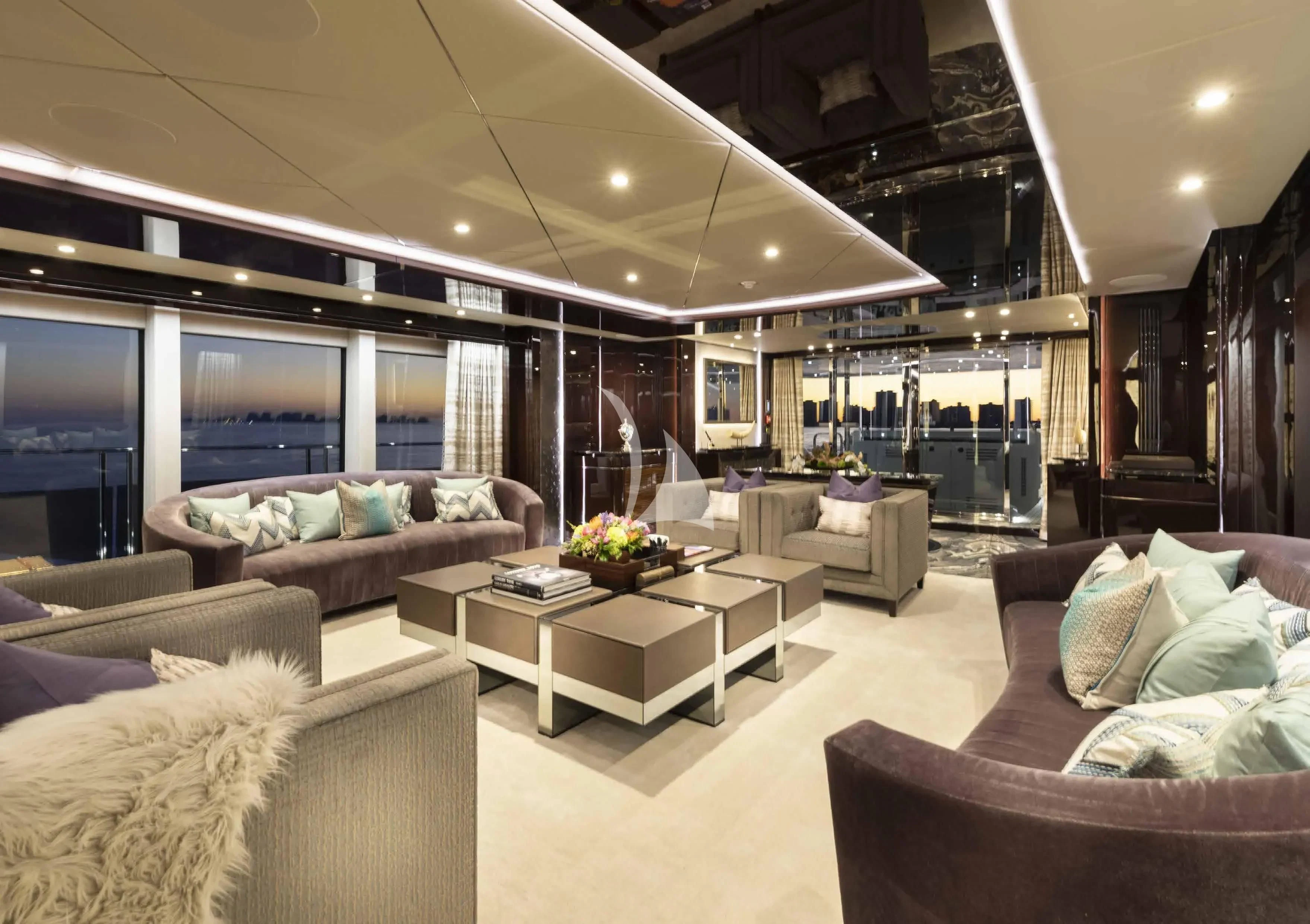 a living room with a large window aboard NEXUS Yacht for Charter