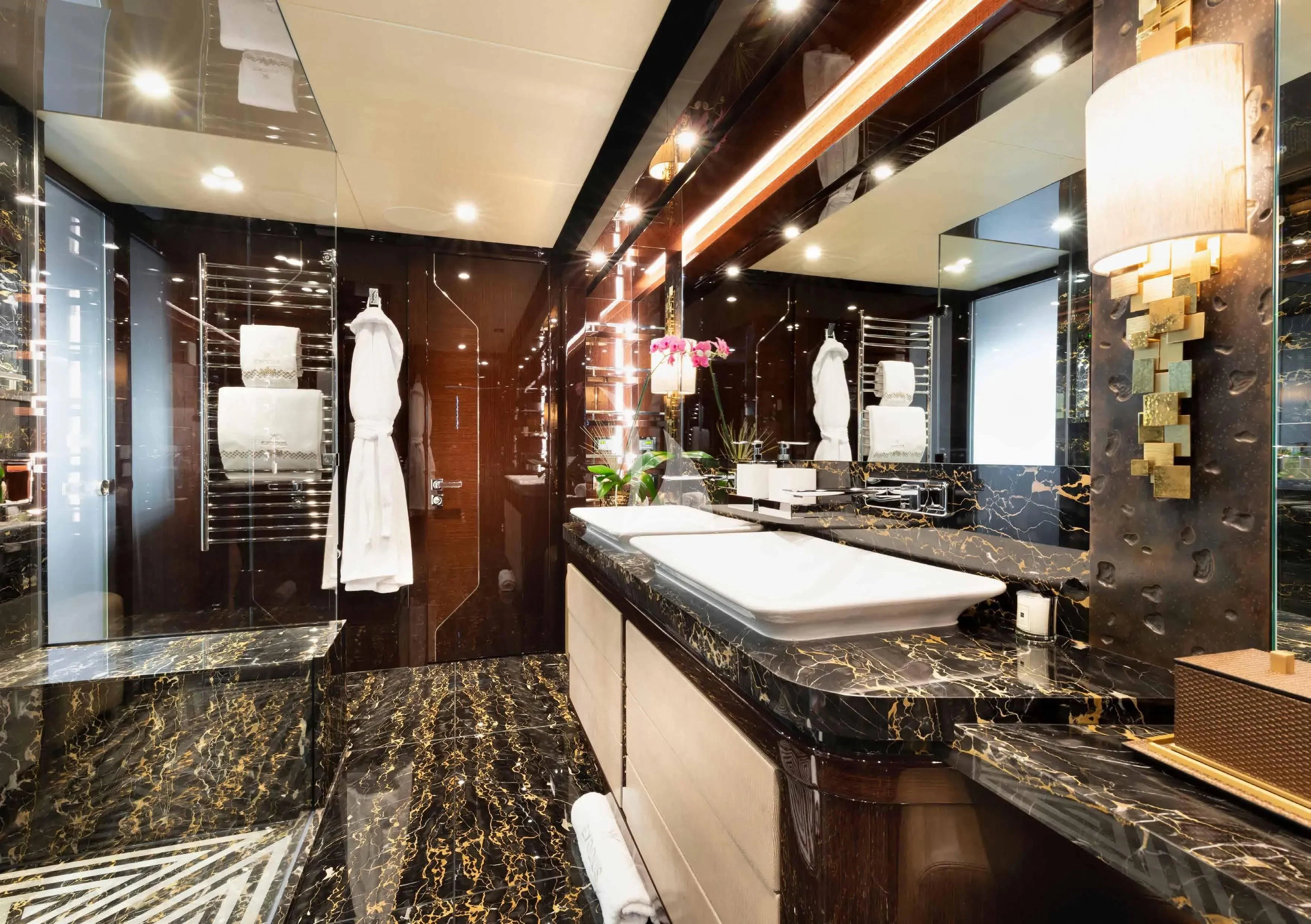 a bathroom with a large marble countertop aboard NEXUS Yacht for Charter