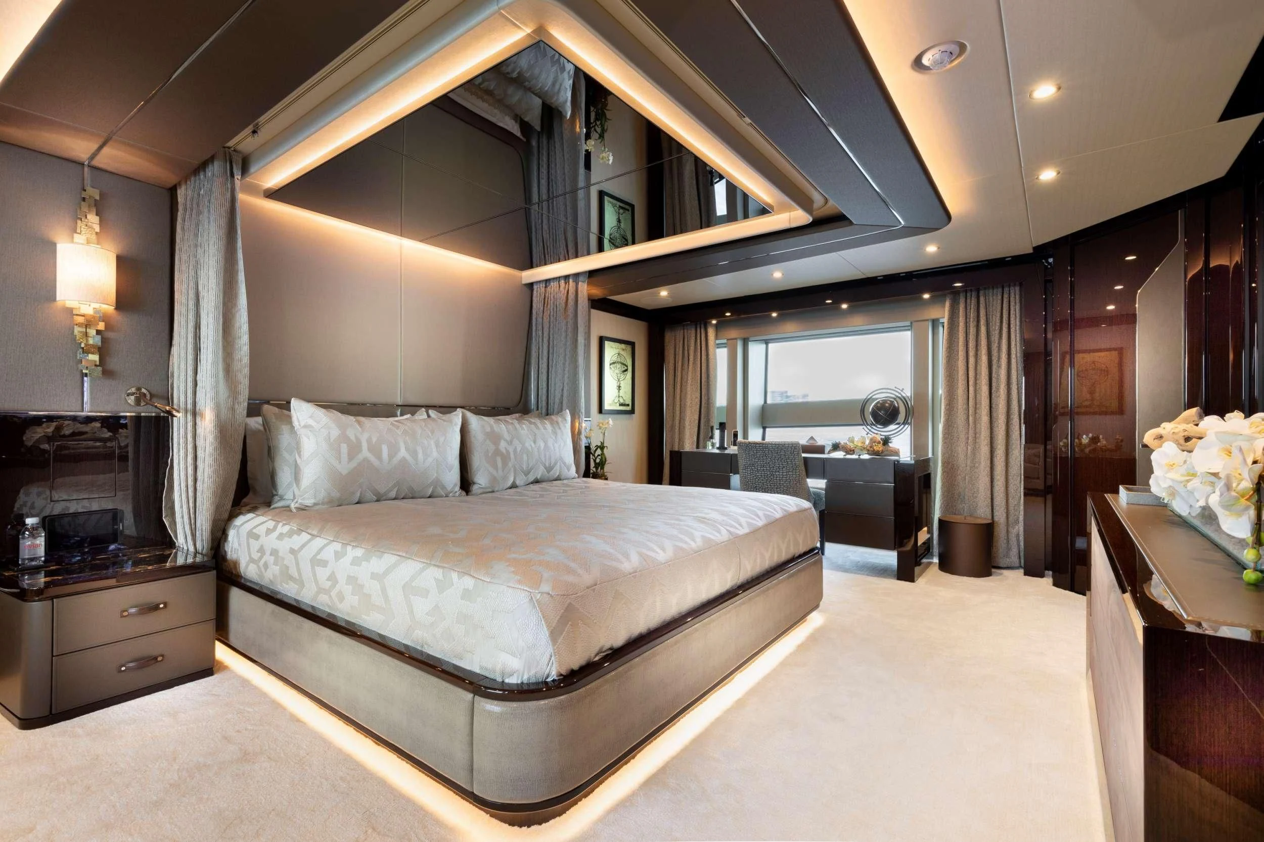 a large bed in a room aboard NEXUS Yacht for Charter