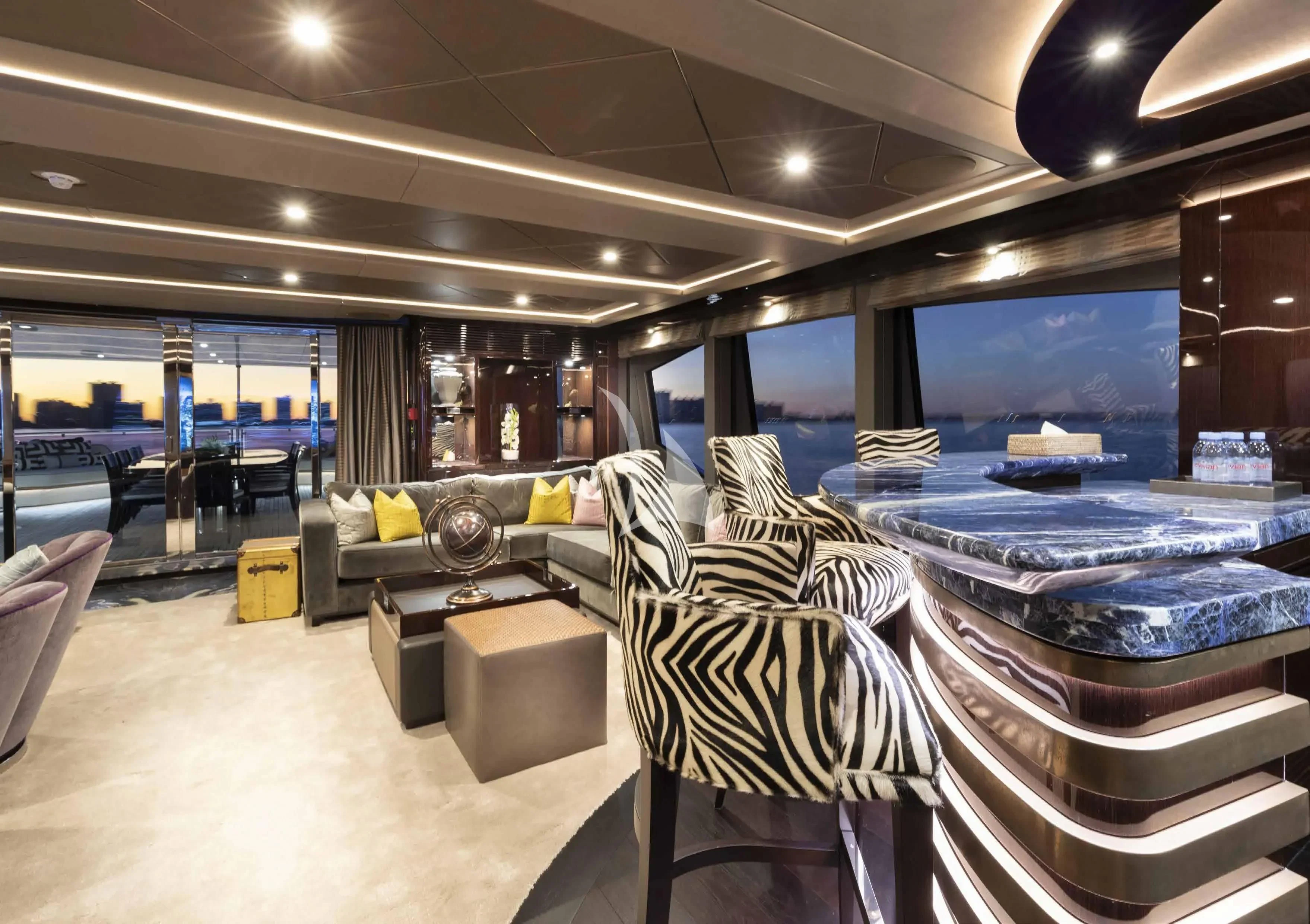 a room with a large table and chairs aboard NEXUS Yacht for Charter