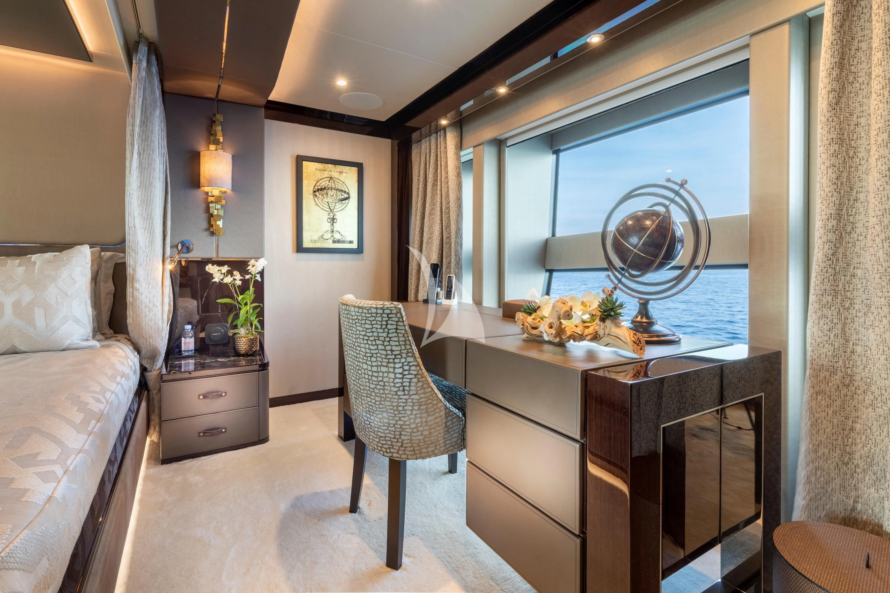 a bedroom with a large window aboard NEXUS Yacht for Charter