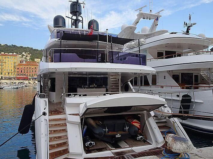 a boat with a ladder on the deck aboard NEXUS Yacht for Charter