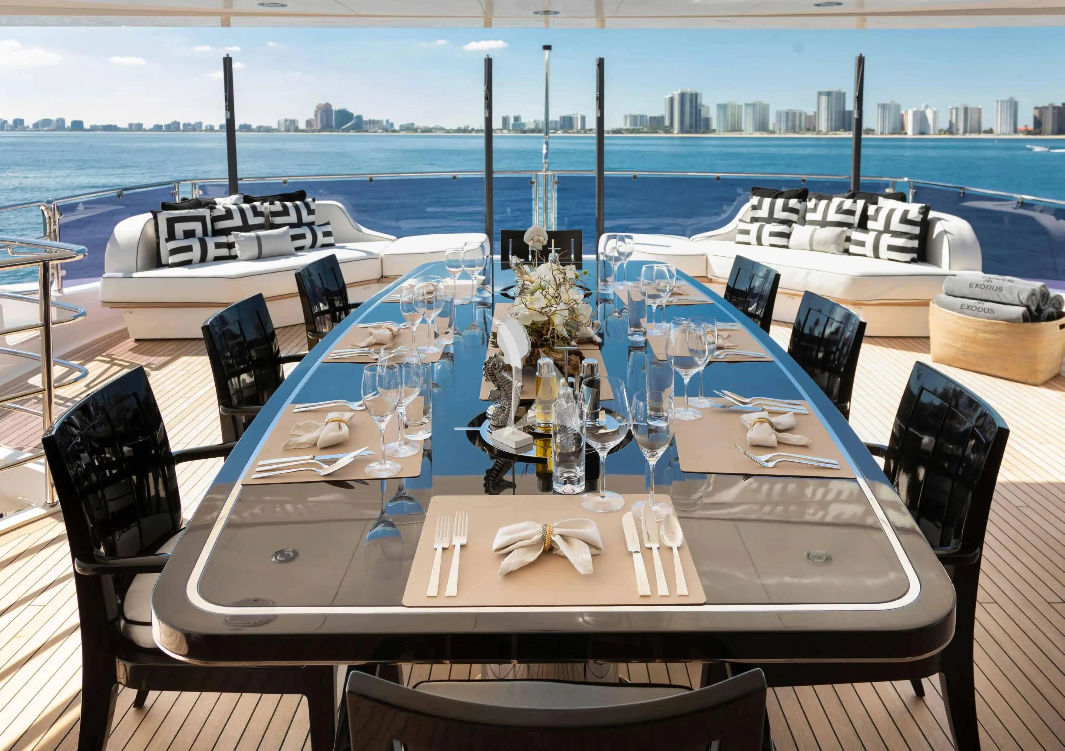 a table set for a dinner aboard NEXUS Yacht for Charter